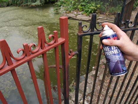 Priming metal railings with PlastiKote Metal Primer in Red Oxide