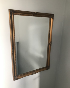 The gold mirror before